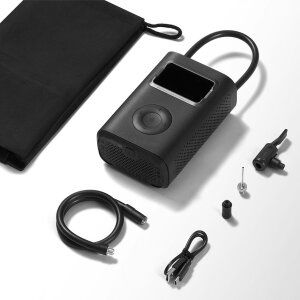 Integrierte LED-Notfallleuchte des Xiaomi Luftkompressors 2 Pro beleuchtet ein Reifenventil bei Dunkelheit.