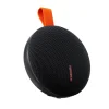 Lightweight and portable Xiaomi Bluetooth Speaker Essential held in one hand to show its size.
