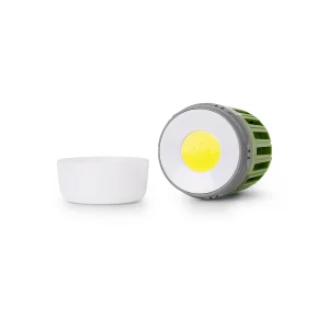 Green ENTAC LED Lantern against mosquitoes on a garden table, creating a cozy, insect-free atmosphere, ideal for Lifestyle & Tech and Saison & Outdoor enjoyment.